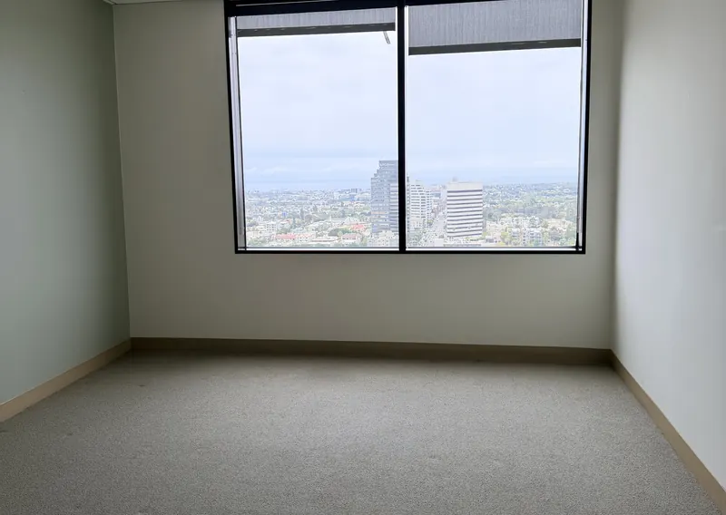 An empty office with desks and natural light